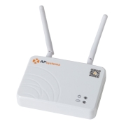 White AP Systems wireless access point with two adjustable antennas and status LEDs on a compact white box area label AP Systems and a QR code sticker nearby.