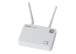 White AP Systems wireless access point with two adjustable antennas and status LEDs on a compact white box area label AP Systems and a QR code sticker nearby.